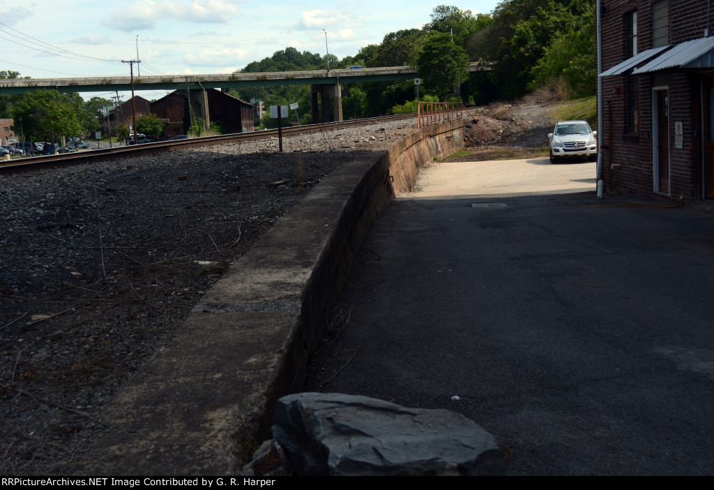 Some ancient railroad infrastructure...  The Southern's original main line once followed the curve of this retaining wall and down the middle of Jefferson Street.  Line was moved to its current location in early 1970 or '71.